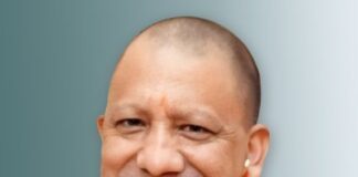 Up cm yogi Adityanath smiling wrapped in saffron clothes