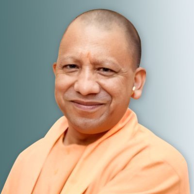 Up cm yogi Adityanath smiling wrapped in saffron clothes 