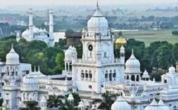 White building with round dom on the top is seen of KGMU Lucknow campus
