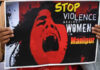 Manipur girl crying with a playcard written stop Violence
