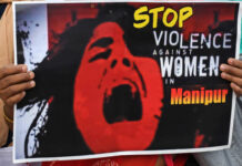 Manipur girl crying with a playcard written stop Violence
