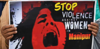 Manipur girl crying with a playcard written stop Violence